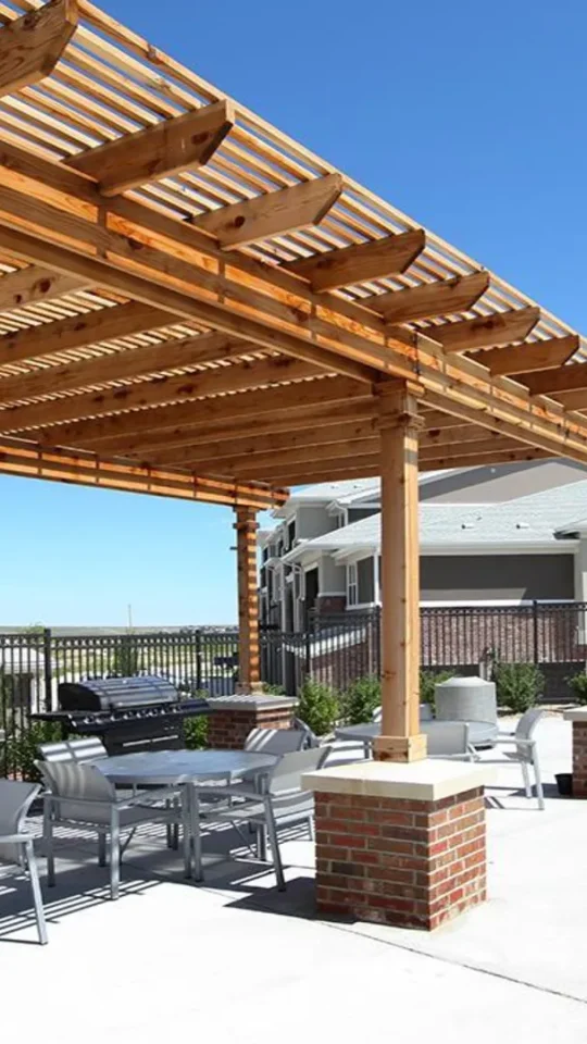 patio with tables and chairs at The Outlook Ridge Apartments