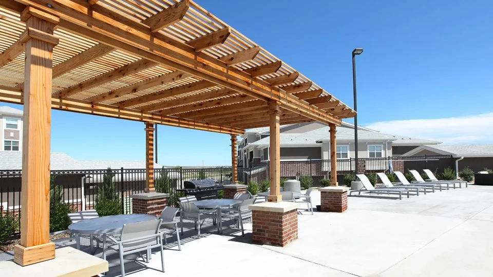 patio with tables and chairs at The Outlook Ridge Apartments